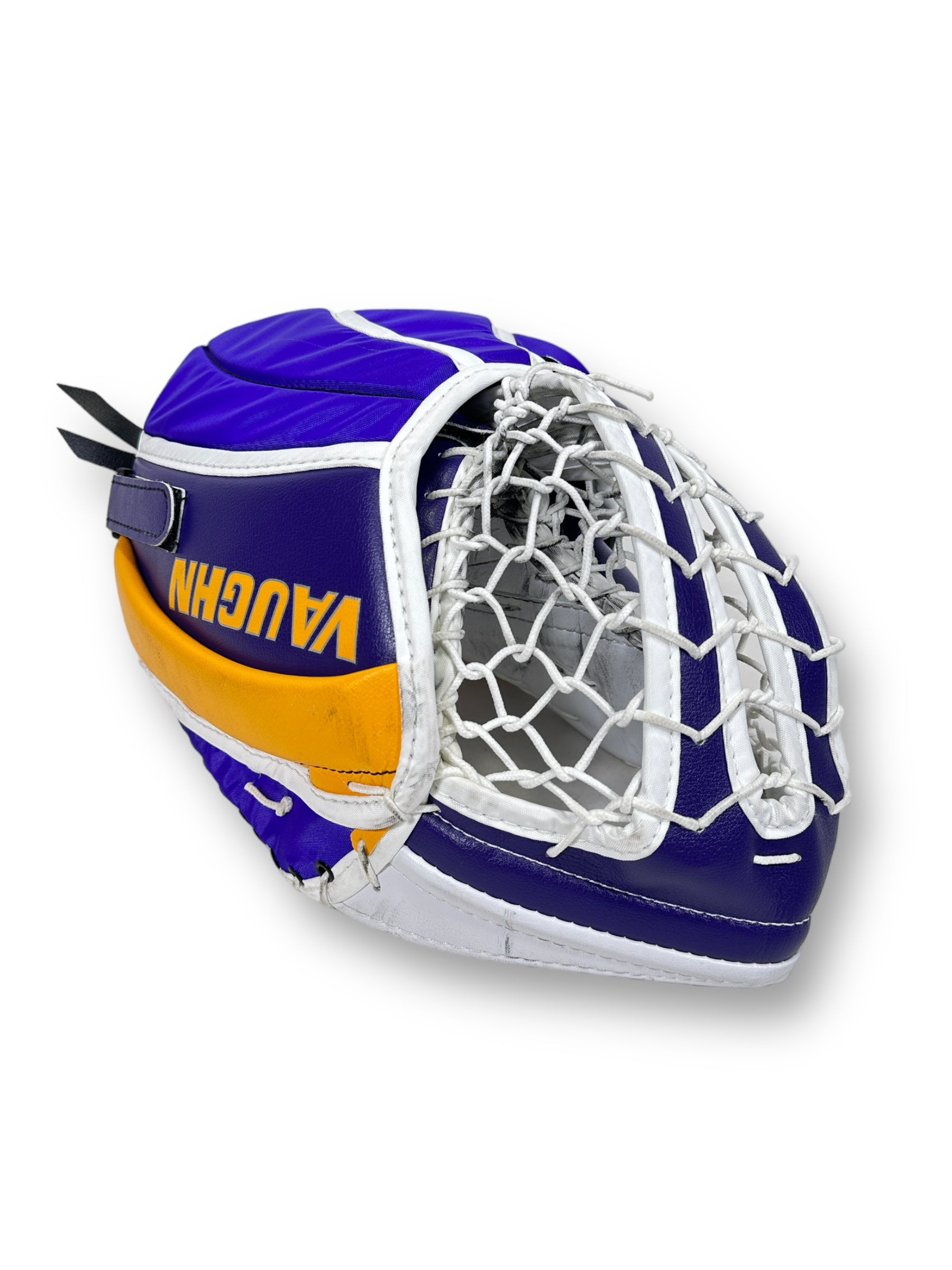 Back side of the finger side of the glove with forum blue and navy blue, and gold, trimmed with white. Branded with "VAUGHN" in gold on a purple field with gold above it. Also pictured is the double-t pocket.