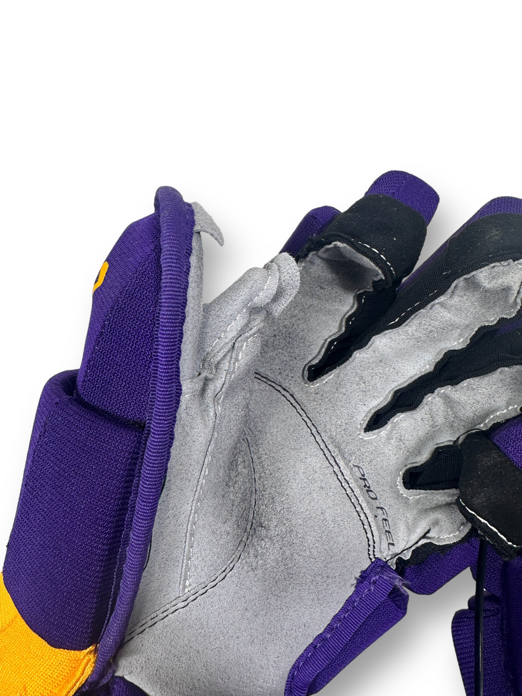 Up-close view of the cut thumb loop, which is present on both hands.