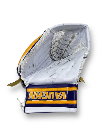 White goalie glove, with forum blue banding, branded with "VAUGHN," in between two gold stripes.